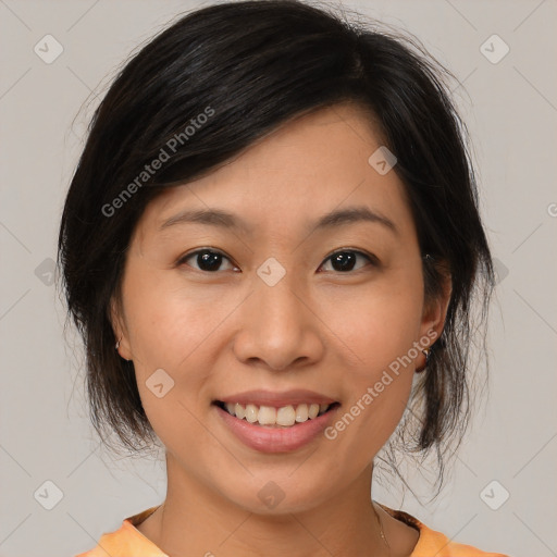 Joyful asian young-adult female with medium  brown hair and brown eyes