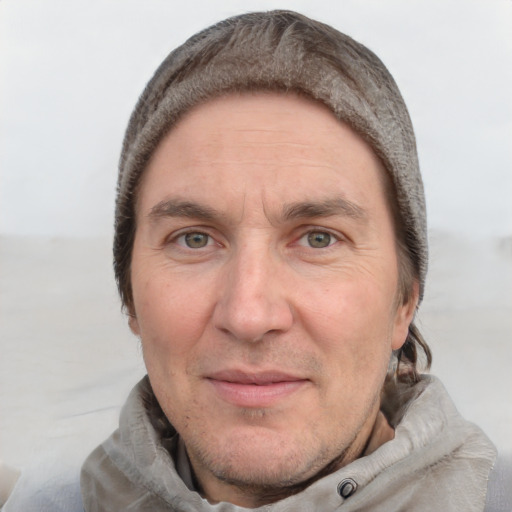 Joyful white adult male with short  brown hair and grey eyes