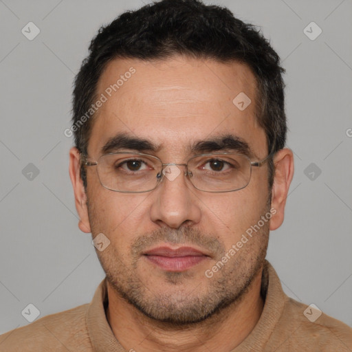 Joyful white adult male with short  black hair and brown eyes