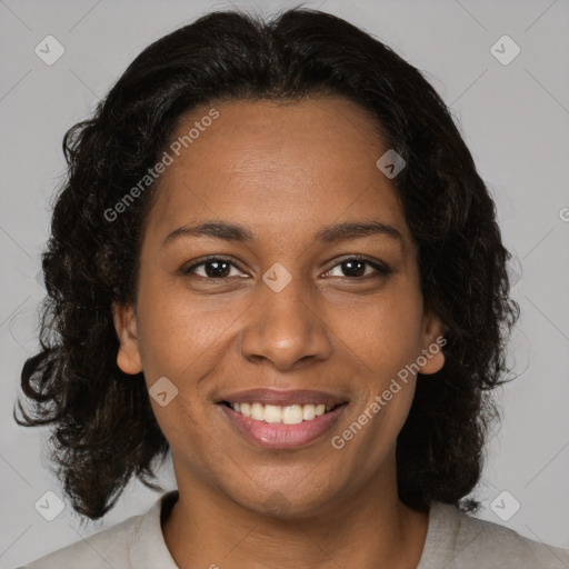 Joyful black young-adult female with medium  brown hair and brown eyes