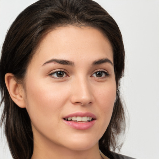 Joyful white young-adult female with medium  brown hair and brown eyes