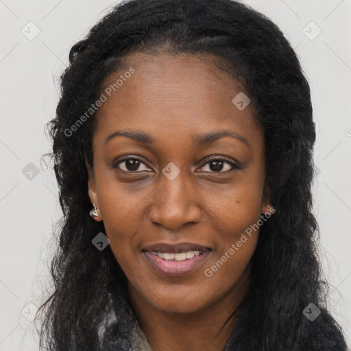 Joyful black young-adult female with long  brown hair and brown eyes