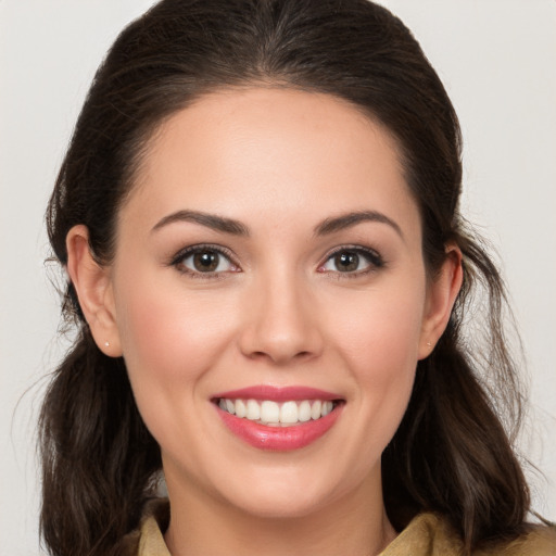 Joyful white young-adult female with medium  brown hair and brown eyes