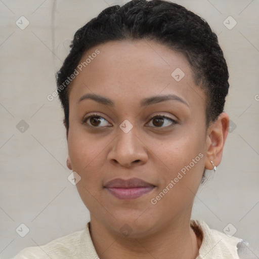 Joyful black young-adult female with short  brown hair and brown eyes