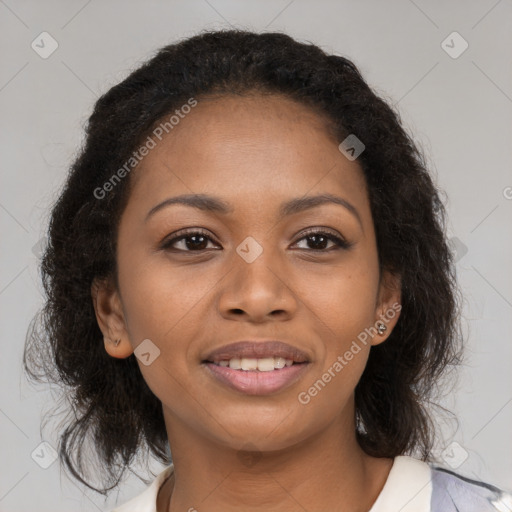 Joyful black young-adult female with medium  brown hair and brown eyes