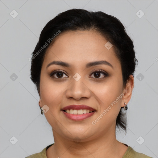 Joyful latino young-adult female with medium  black hair and brown eyes