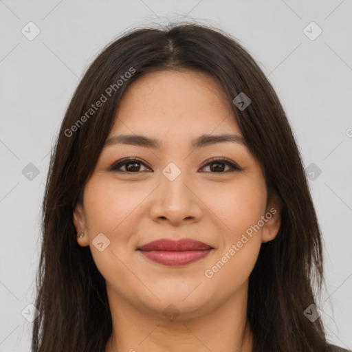 Joyful latino young-adult female with long  brown hair and brown eyes