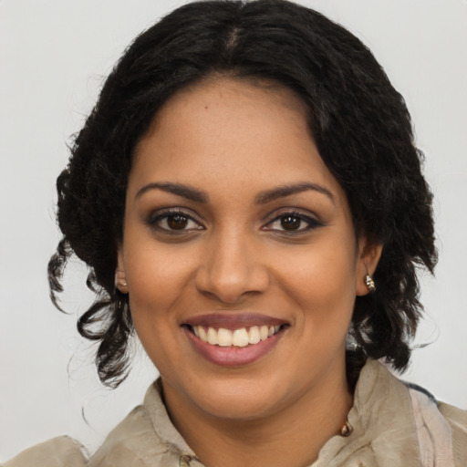 Joyful latino young-adult female with long  brown hair and brown eyes