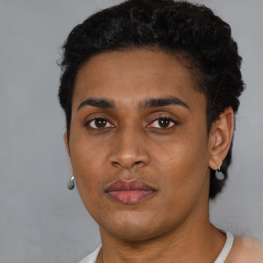 Neutral black young-adult female with short  black hair and brown eyes
