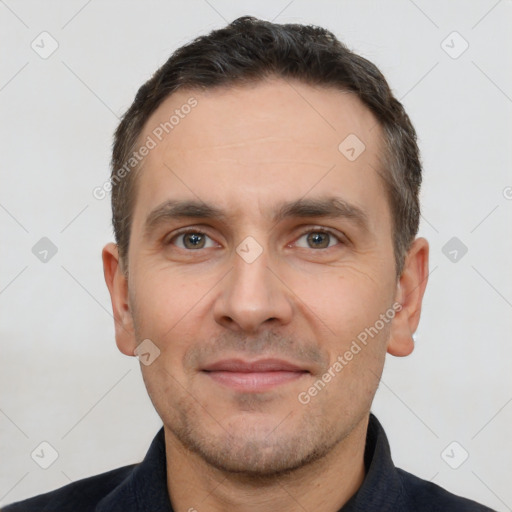 Joyful white adult male with short  brown hair and brown eyes