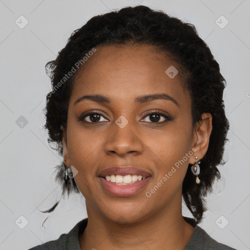 Joyful black young-adult female with medium  black hair and brown eyes