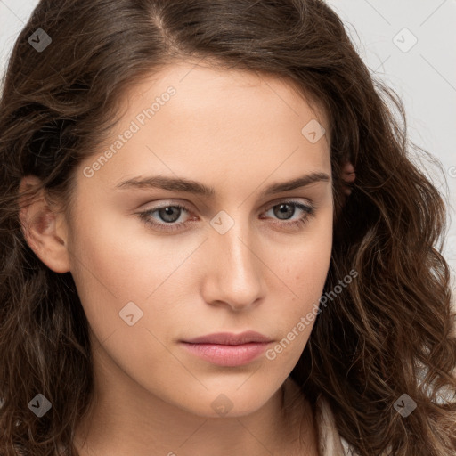 Neutral white young-adult female with long  brown hair and brown eyes