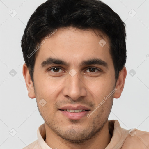 Joyful white young-adult male with short  black hair and brown eyes