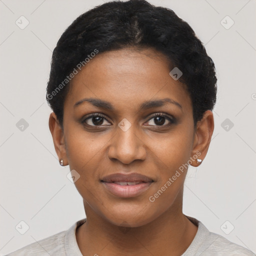 Joyful black young-adult female with short  black hair and brown eyes