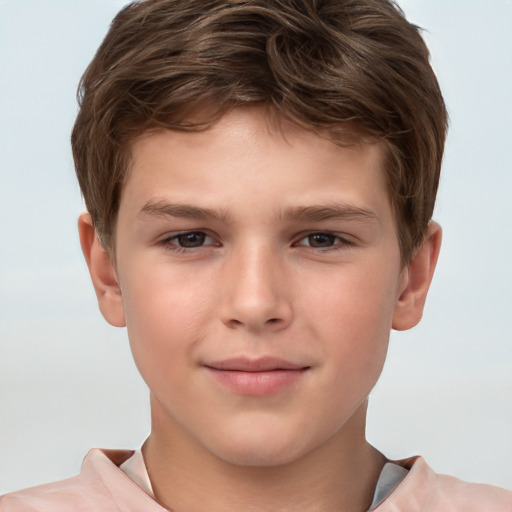 Joyful white child male with short  brown hair and brown eyes