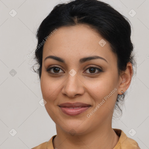 Joyful latino young-adult female with medium  brown hair and brown eyes