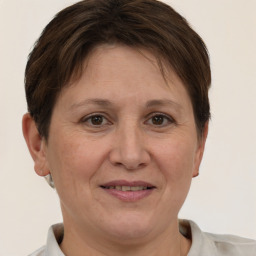 Joyful white adult female with short  brown hair and brown eyes