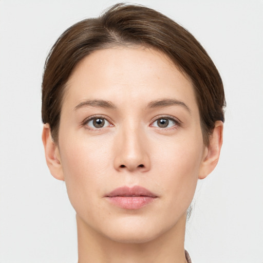 Neutral white young-adult female with short  brown hair and brown eyes