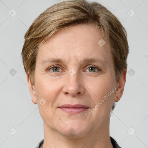 Joyful white adult female with short  brown hair and grey eyes