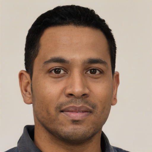 Neutral latino young-adult male with short  black hair and brown eyes