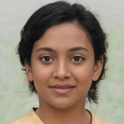 Joyful latino young-adult female with medium  black hair and brown eyes