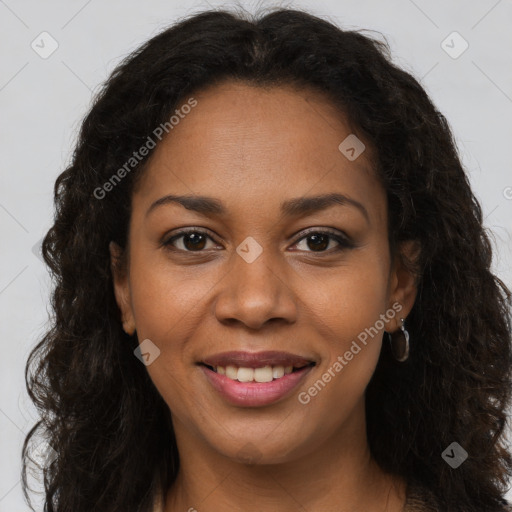 Joyful black young-adult female with long  brown hair and brown eyes