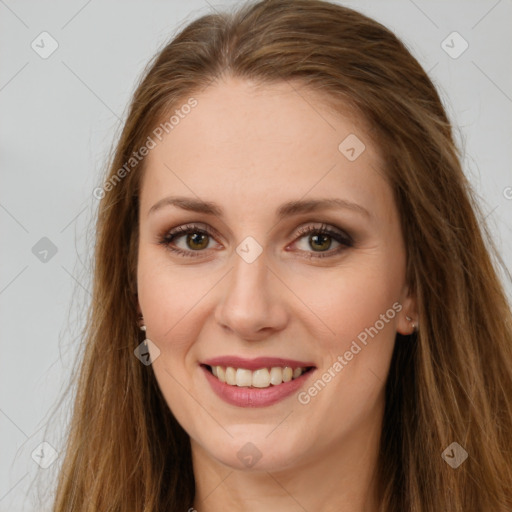 Joyful white young-adult female with long  brown hair and green eyes