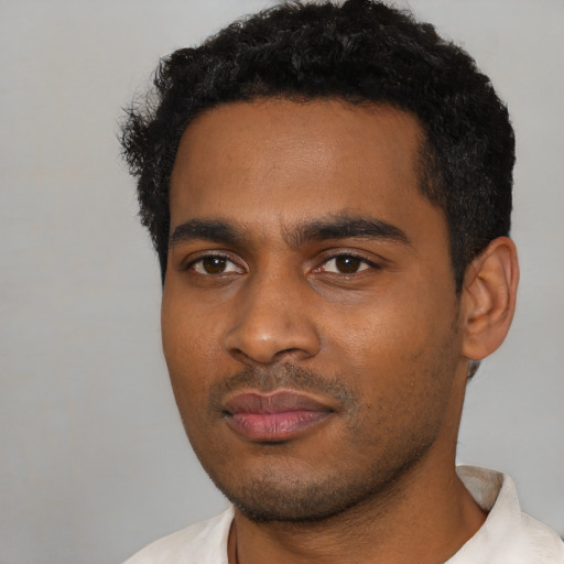 Neutral black young-adult male with short  black hair and brown eyes