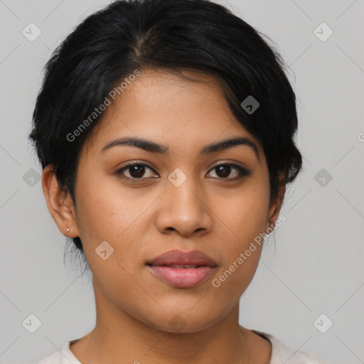 Joyful latino young-adult female with short  black hair and brown eyes