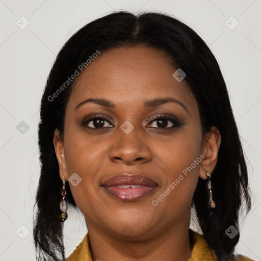 Joyful black young-adult female with long  brown hair and brown eyes