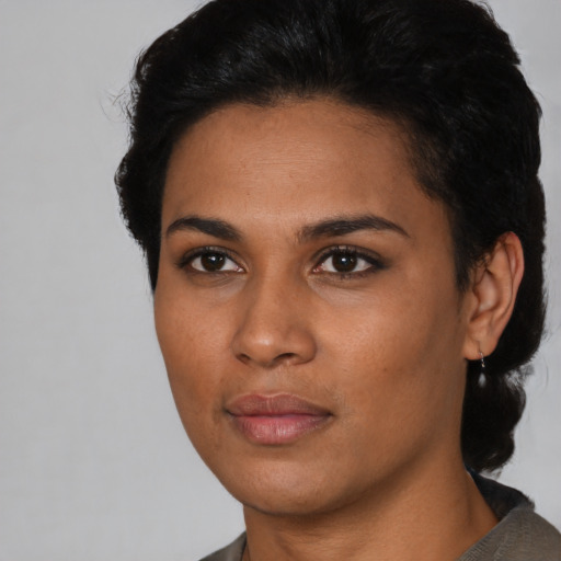 Neutral latino young-adult female with short  black hair and brown eyes