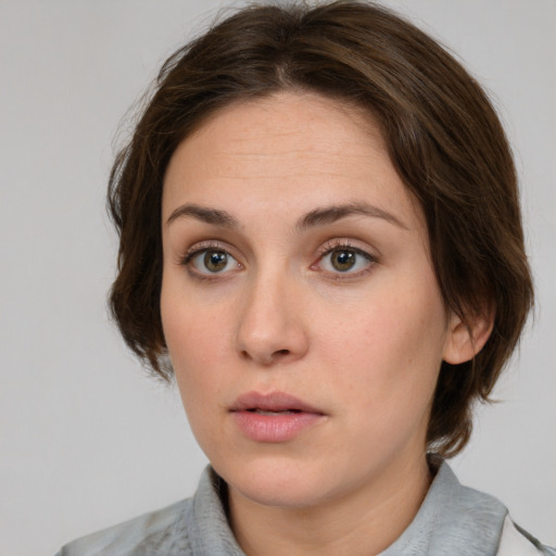 Neutral white young-adult female with medium  brown hair and grey eyes