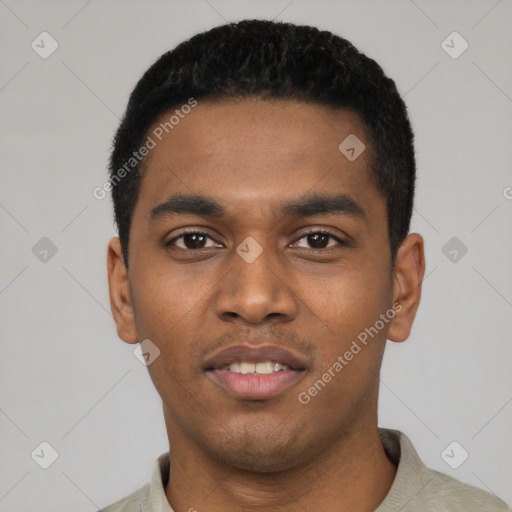 Joyful latino young-adult male with short  black hair and brown eyes