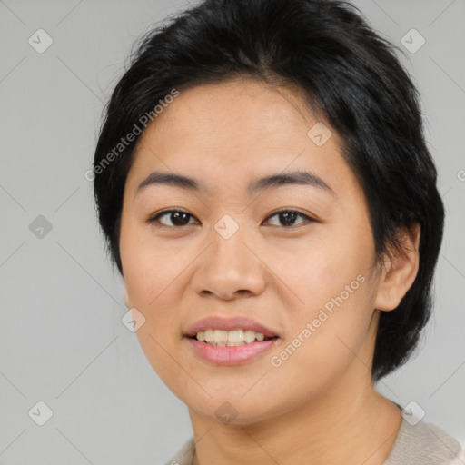 Joyful asian young-adult female with medium  black hair and brown eyes