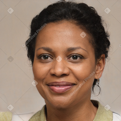 Joyful black adult female with medium  brown hair and brown eyes