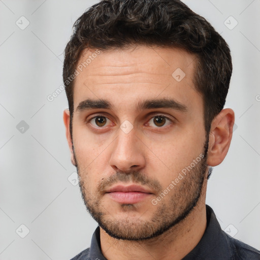 Neutral white young-adult male with short  brown hair and brown eyes