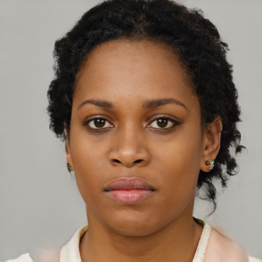 Neutral black young-adult female with short  brown hair and brown eyes