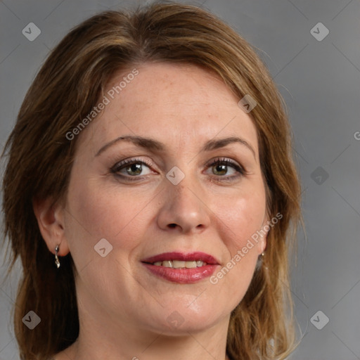 Joyful white adult female with medium  brown hair and grey eyes