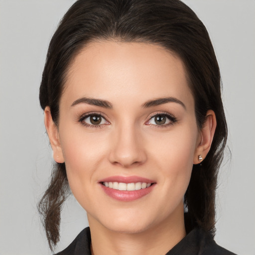 Joyful white young-adult female with medium  brown hair and brown eyes