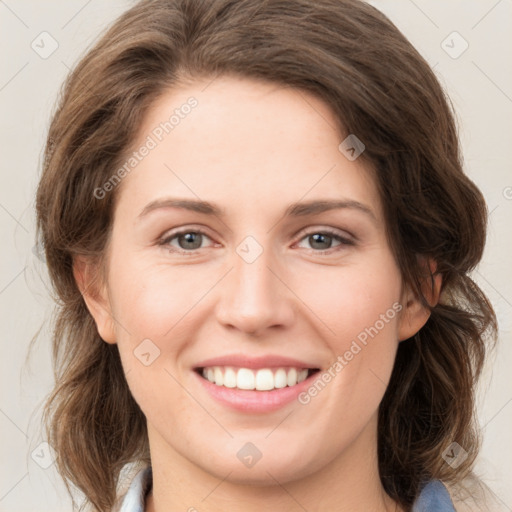 Joyful white young-adult female with medium  brown hair and green eyes