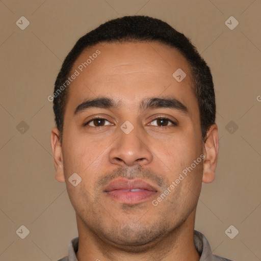 Neutral latino young-adult male with short  brown hair and brown eyes