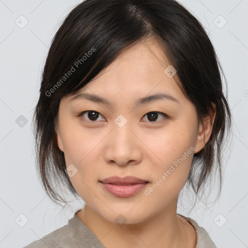 Joyful asian young-adult female with medium  brown hair and brown eyes