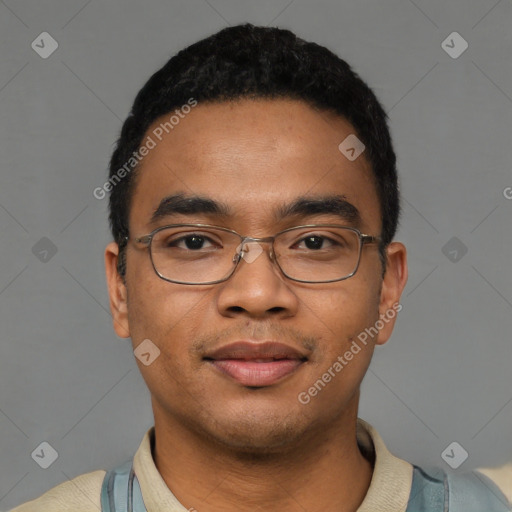 Joyful latino young-adult male with short  black hair and brown eyes