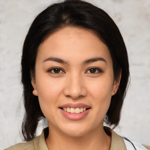 Joyful white young-adult female with medium  brown hair and brown eyes