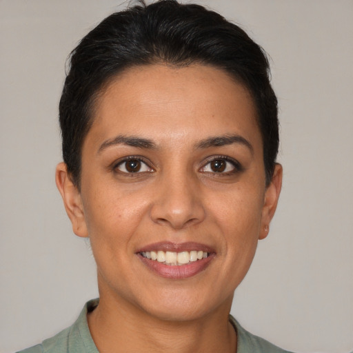 Joyful white young-adult female with short  brown hair and brown eyes