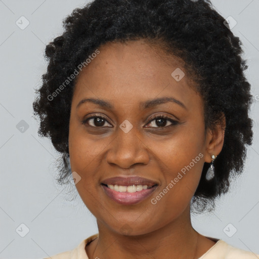 Joyful black adult female with long  brown hair and brown eyes