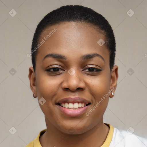 Joyful black young-adult female with short  black hair and brown eyes