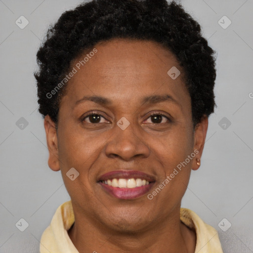 Joyful black adult female with short  brown hair and brown eyes