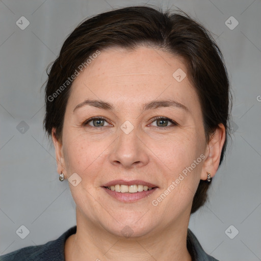 Joyful white adult female with medium  brown hair and grey eyes