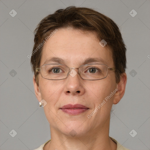 Joyful white adult female with short  brown hair and grey eyes